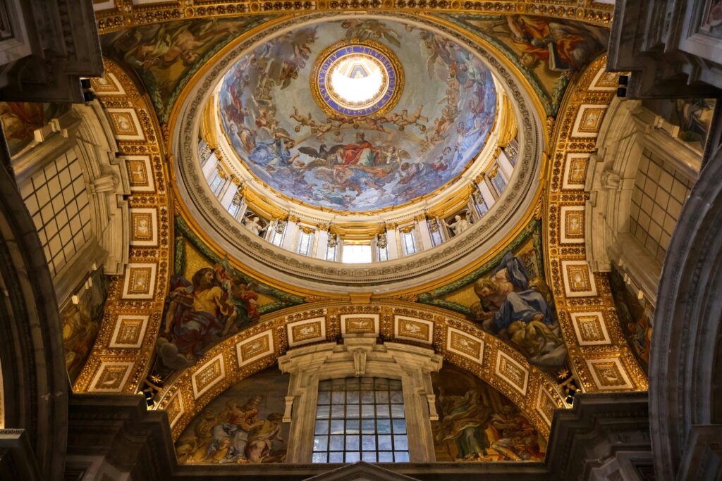 pexels-photo-25853135-25853135 Explore the breathtaking artistic ceiling of the St. Peter's Basilica dome in Vatican City, showcasing religious frescoes.